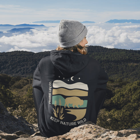 Celebrate the beauty of the prairies with this bold color-blocked hoodie featuring a striking bison silhouette, golden wheat fields, and an open prairie sky.