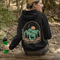 This graphic hoodie features a majestic deer standing against a wilderness backdrop— mountains, towering pines, a glowing moon, and a star-filled night sky.