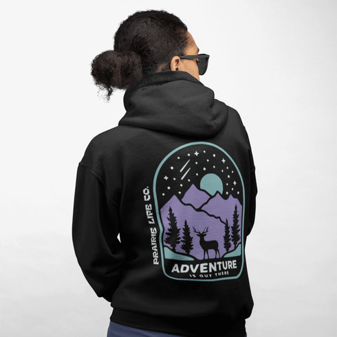 This hoodie features a graphic of a deer standing in the mountains beneath a moonlit sky, everything we love about the quiet magic of the wilderness.