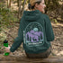 This hoodie features a graphic of a deer standing in the mountains beneath a moonlit sky, everything we love about the quiet magic of the wilderness.