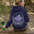 This hoodie features a graphic of a deer standing in the mountains beneath a moonlit sky, everything we love about the quiet magic of the wilderness.