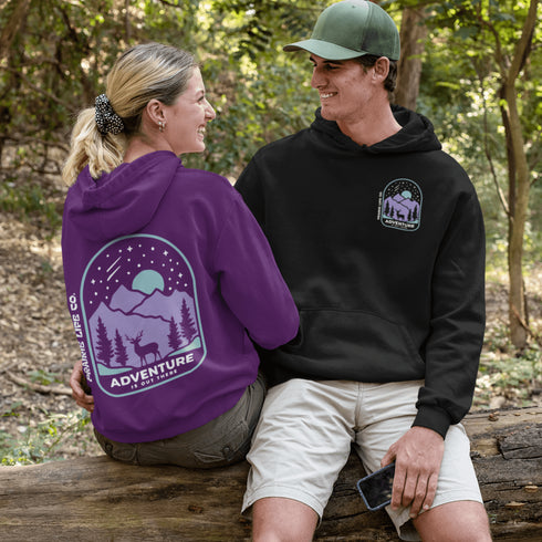 This hoodie features a graphic of a deer standing in the mountains beneath a moonlit sky, everything we love about the quiet magic of the wilderness.