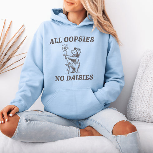 Meet your new favorite hoodie: a cuddly bear holding a giant daisy and the brutally honest mantra, "All Oopsies, No Daisies."