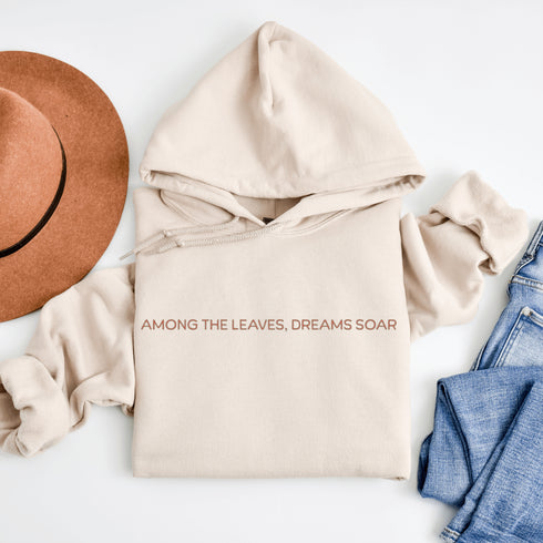 Wrap yourself in the charm of nature with our Among the Leaves Hoodie, a wearable piece of folk art that celebrates the harmony of birds, branches, and blooms.