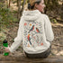 Wrap yourself in the charm of nature with our Among the Leaves Hoodie, a wearable piece of folk art that celebrates the harmony of birds, branches, and blooms.