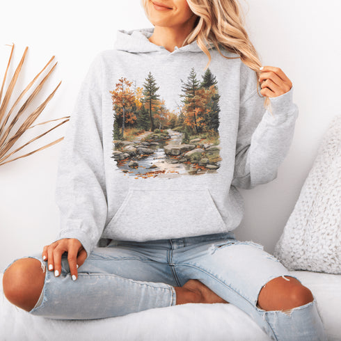 This stunning design features a serene autumn forest scene, complete with vibrant foliage and a peaceful creek winding its way through nature’s splendor.