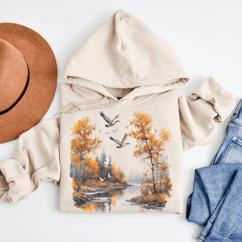 This design captures a stunning autumn forest scene, complete with vibrant golden leaves, a tranquil creek, and graceful geese soaring across the sky.