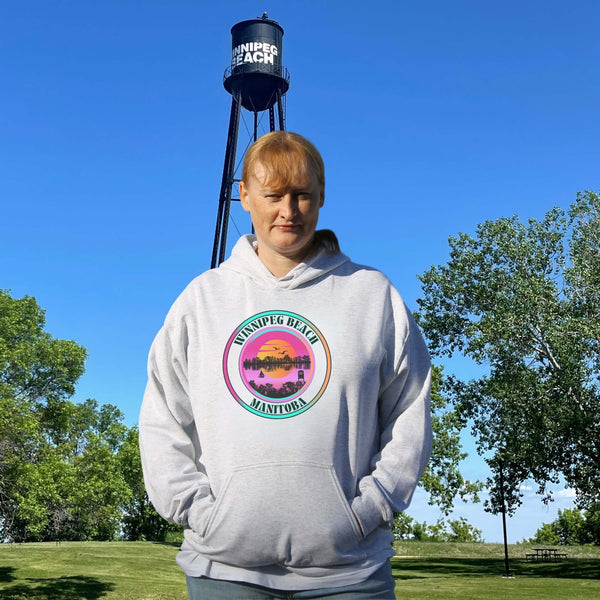 Featuring a dreamy sunset scene with the iconic Winnipeg Beach water tower standing tall, this hoodie gives you all the feels of a perfect beach day without the sand in your shoes.
