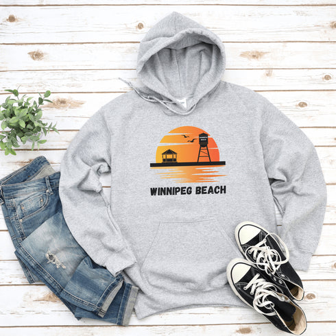 Introducing the "Winnipeg Beach Sunset Hoodie" – because nothing says relaxation like a sunset and a water tower! Whether you're reminiscing about lazy beach days or just need an excuse to wear something cozy, this hoodie captures all the magic of Winnipeg Beach.