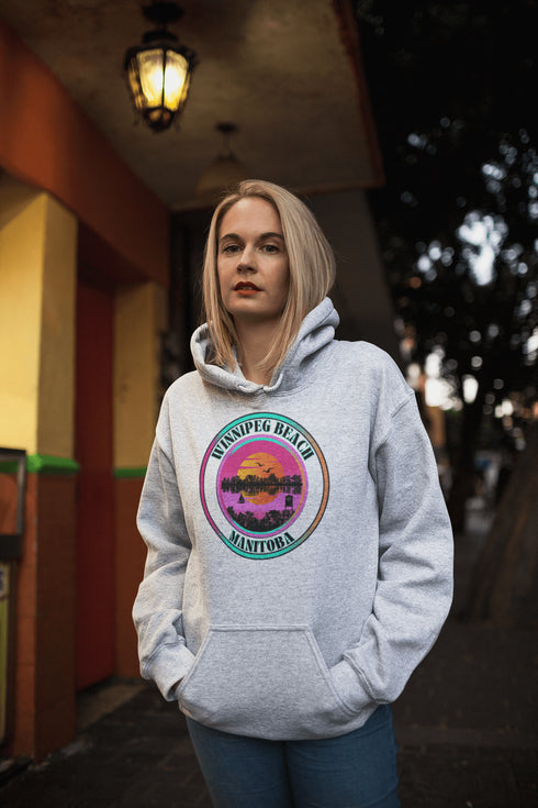 Featuring a dreamy sunset scene with the iconic Winnipeg Beach water tower standing tall, this hoodie gives you all the feels of a perfect beach day without the sand in your shoes.