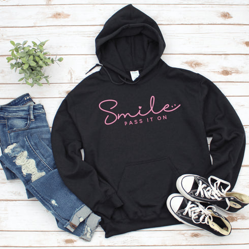 Introducing the latest in wearable cheer technology: the "Smile, Pass It On" Hoodie! This isn't just any ordinary hoodie. Oh no, it's your new best friend, fashion statement, and personal cheerleader all rolled into one cozy package.