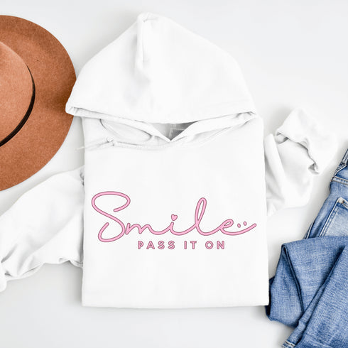 Introducing the latest in wearable cheer technology: the "Smile, Pass It On" Hoodie! This isn't just any ordinary hoodie. Oh no, it's your new best friend, fashion statement, and personal cheerleader all rolled into one cozy package.