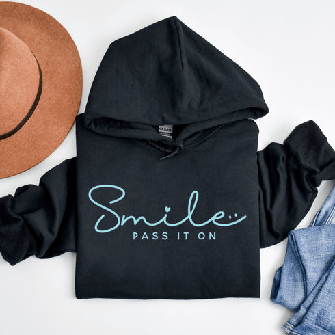 Introducing the latest in wearable cheer technology: the "Smile, Pass It On" Hoodie! This isn't just any ordinary hoodie. Oh no, it's your new best friend, fashion statement, and personal cheerleader all rolled into one cozy package.