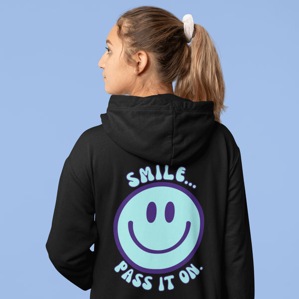 Introducing the latest must-have in your wardrobe that's guaranteed to turn frowns upside down: the Happy Face Hoodie emblazoned with the cheer-spreading command, "Smile...Pass it on." This isn't just any ordinary hoodie; it's your ticket to becoming a walking, talking (and very cozy) ambassador of joy!