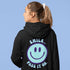 Introducing the latest must-have in your wardrobe that's guaranteed to turn frowns upside down: the Happy Face Hoodie emblazoned with the cheer-spreading command, "Smile...Pass it on." This isn't just any ordinary hoodie; it's your ticket to becoming a walking, talking (and very cozy) ambassador of joy!