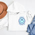 Introducing the latest must-have in your wardrobe that's guaranteed to turn frowns upside down: the Happy Face Hoodie emblazoned with the cheer-spreading command, "Smile...Pass it on." This isn't just any ordinary hoodie; it's your ticket to becoming a walking, talking (and very cozy) ambassador of joy!