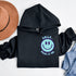Introducing the latest must-have in your wardrobe that's guaranteed to turn frowns upside down: the Happy Face Hoodie emblazoned with the cheer-spreading command, "Smile...Pass it on." This isn't just any ordinary hoodie; it's your ticket to becoming a walking, talking (and very cozy) ambassador of joy!