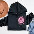 Introducing the latest must-have in your wardrobe that's guaranteed to turn frowns upside down: the Happy Face Hoodie emblazoned with the cheer-spreading command, "Smile...Pass it on." This isn't just any ordinary hoodie; it's your ticket to becoming a walking, talking (and very cozy) ambassador of joy!