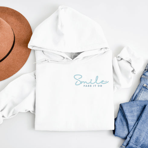 Introducing the ultimate mood lifter and smile inducer: the "Smile...Pass It On" Hoodie! Made with 100% organic cotton that's so soft, even a cactus would feel cuddly wearing it. This isn't just any hoodie; it's your wearable reminder to the world that happiness is contagious, and it starts with a simple smile.