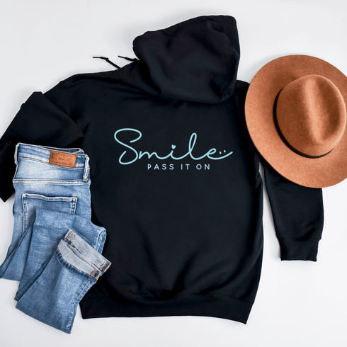 Introducing the ultimate mood lifter and smile inducer: the "Smile...Pass It On" Hoodie! Made with 100% organic cotton that's so soft, even a cactus would feel cuddly wearing it. This isn't just any hoodie; it's your wearable reminder to the world that happiness is contagious, and it starts with a simple smile.