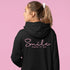 Introducing the ultimate mood lifter and smile inducer: the "Smile...Pass It On" Hoodie! Made with 100% organic cotton that's so soft, even a cactus would feel cuddly wearing it. This isn't just any hoodie; it's your wearable reminder to the world that happiness is contagious, and it starts with a simple smile.