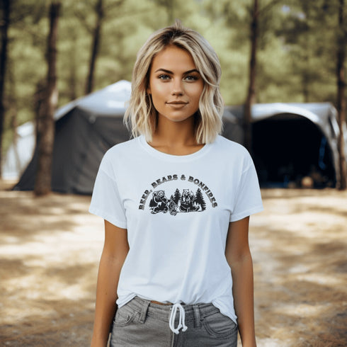 Introducing our hilarious "Beer, Bears & Bonfires" t-shirt! Picture this: a couple of camping bears enjoying a cold one in the woods, gathered around a crackling bonfire. These fun-loving bears know how to have a good time, and now you can join in on the fun too!