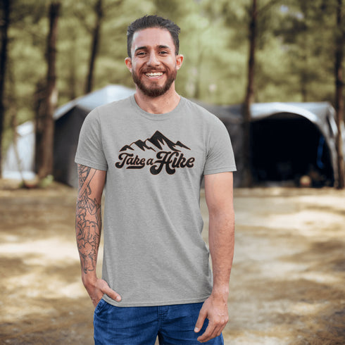 Introducing our rugged and stylish hiking t-shirt, perfect for outdoor enthusiasts and nature lovers alike. Featuring a striking mountain graphic and the motivational slogan "Take A Hike", this shirt is designed to inspire your next camping adventure.