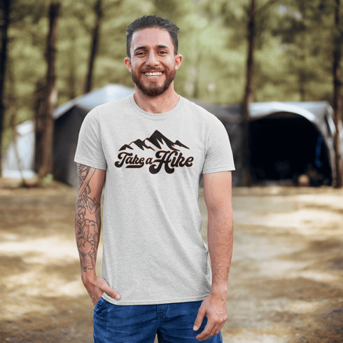 Introducing our rugged and stylish hiking t-shirt, perfect for outdoor enthusiasts and nature lovers alike. Featuring a striking mountain graphic and the motivational slogan "Take A Hike", this shirt is designed to inspire your next camping adventure.