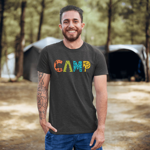 Introducing our vibrant and adventurous camping t-shirt! Featuring bold and colorful "Camp" letters adorned with charming camping icons cut out, this shirt is perfect for outdoor enthusiasts and nature lovers alike.