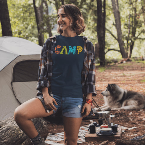 Introducing our vibrant and adventurous camping t-shirt! Featuring bold and colorful "Camp" letters adorned with charming camping icons cut out, this shirt is perfect for outdoor enthusiasts and nature lovers alike.
