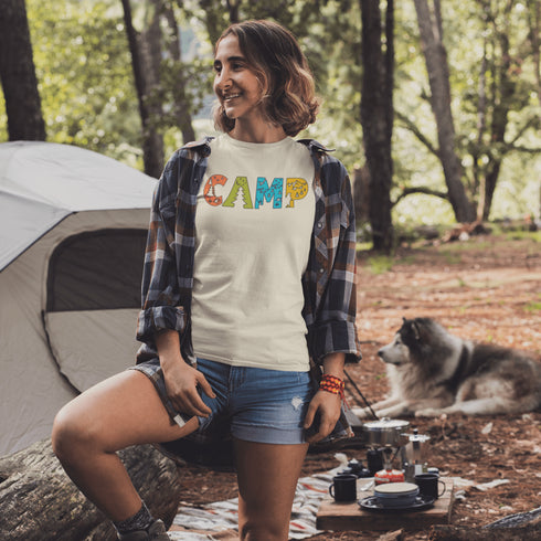 Introducing our vibrant and adventurous camping t-shirt! Featuring bold and colorful "Camp" letters adorned with charming camping icons cut out, this shirt is perfect for outdoor enthusiasts and nature lovers alike.