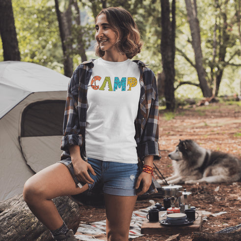 Introducing our vibrant and adventurous camping t-shirt! Featuring bold and colorful "Camp" letters adorned with charming camping icons cut out, this shirt is perfect for outdoor enthusiasts and nature lovers alike.