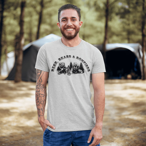 Introducing our hilarious "Beer, Bears & Bonfires" t-shirt! Picture this: a couple of camping bears enjoying a cold one in the woods, gathered around a crackling bonfire. These fun-loving bears know how to have a good time, and now you can join in on the fun too!