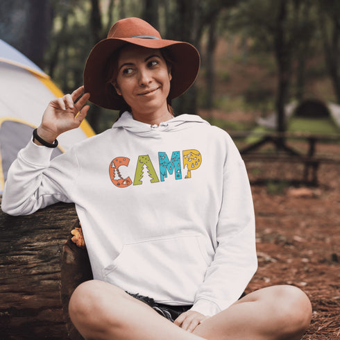 Introducing our vibrant and adventurous camping hoodie! Featuring bold and colorful "Camp" letters adorned with charming camping icons cut out, this shirt is perfect for outdoor enthusiasts and nature lovers alike.