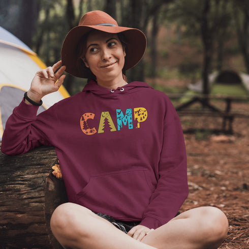Introducing our vibrant and adventurous camping hoodie! Featuring bold and colorful "Camp" letters adorned with charming camping icons cut out, this shirt is perfect for outdoor enthusiasts and nature lovers alike.