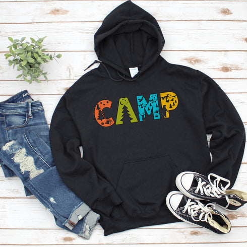 Introducing our vibrant and adventurous camping hoodie! Featuring bold and colorful "Camp" letters adorned with charming camping icons cut out, this shirt is perfect for outdoor enthusiasts and nature lovers alike.