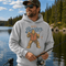 Funny Sasquatch fishing graphic printed on a unisex hoodie featuring a vintage Bigfoot fisherman design, shown on multiple hoodie colors and lifestyle mockups perfect for outdoor and fishing apparel.