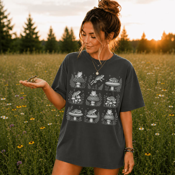 Vintage-inspired frog and mushroom graphic printed on a relaxed-fit Comfort Colors 1717 t-shirt available in multiple garment-dyed colors, shown in a variety of outdoor lifestyle and product mockups.