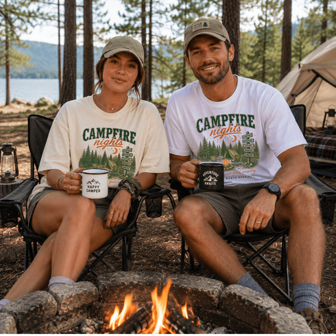 Vintage Campfire Nights camping graphic t-shirt featuring a retro forest campsite with a glowing campfire, tent, pine trees, and outdoor adventure design.