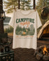 Vintage Campfire Nights camping graphic t-shirt featuring a retro forest campsite with a glowing campfire, tent, pine trees, and outdoor adventure design.