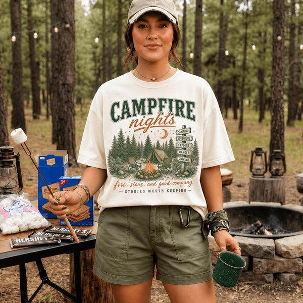 Vintage Campfire Nights camping graphic t-shirt featuring a retro forest campsite with a glowing campfire, tent, pine trees, and outdoor adventure design.