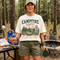 Vintage Campfire Nights camping graphic t-shirt featuring a retro forest campsite with a glowing campfire, tent, pine trees, and outdoor adventure design.