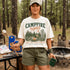 Vintage Campfire Nights camping graphic t-shirt featuring a retro forest campsite with a glowing campfire, tent, pine trees, and outdoor adventure design.