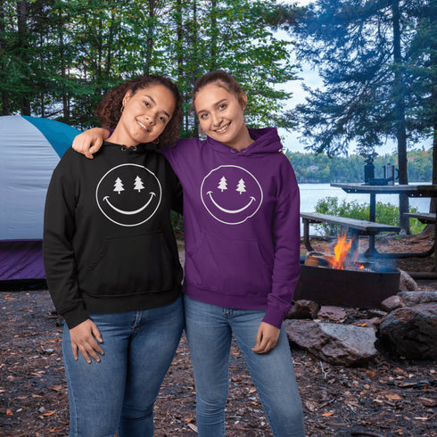 Introducing the latest in outdoor fashion and forest friendliness: the "Tree-mendous Smiles Hoodie"! This isn't just any hoodie; it's your ticket to becoming the most smiley face in the wild. With a dazzling happy face emblazoned on the front, you're set to spread joy among the trees, the birds, and even the most stubborn of rocks.