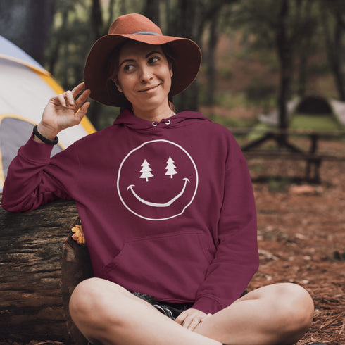 Introducing the latest in outdoor fashion and forest friendliness: the "Tree-mendous Smiles Hoodie"! This isn't just any hoodie; it's your ticket to becoming the most smiley face in the wild. With a dazzling happy face emblazoned on the front, you're set to spread joy among the trees, the birds, and even the most stubborn of rocks.