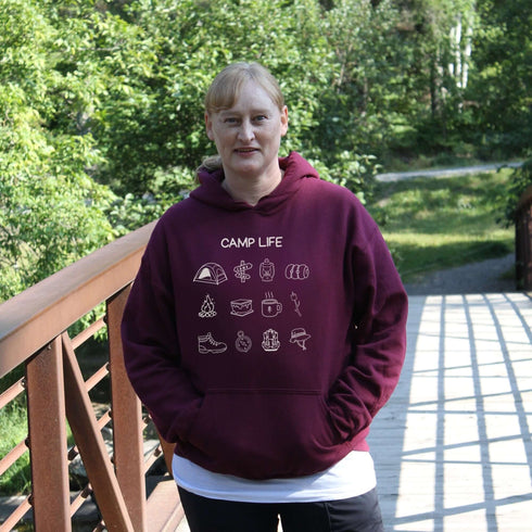 Pitch a tent, roast a marshmallow, and wear your weekend plans! Our Camp Life Hoodie is covered in playful camping doodles