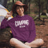 Flip the switch—you're in Camping Mode now. This hoodie says it all in a rugged forest tree font that looks like it was hand-carved by a squirrel with a crafting hobby.