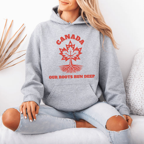 This beautifully designed hoodie features a majestic tree with deep roots, its leaves formed by the iconic Canadian maple leaf.