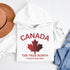 White Canada hoodie with bold maple leaf design and “True North Strong and Free” text, unisex Canadian sweatshirt