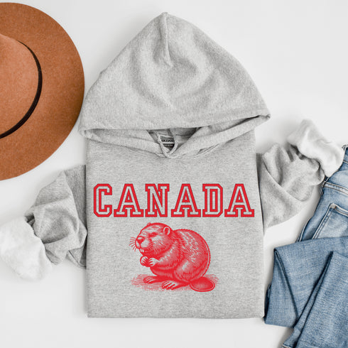 This cozy hoodie features the official mascot of Canadian chill vibes: a Canadian beaver, And smack-dab above the little guy? The iconic word "Canada," so there's no mistaking your loyalty to the land of snow, syrup, and hockey glory!